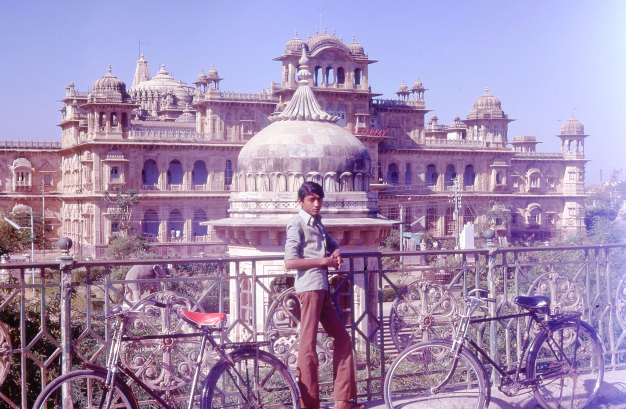 In Morbi with a guide beside my scarlet-saddled bike. Five years later a dam broke, bringing death and destruction to the town.