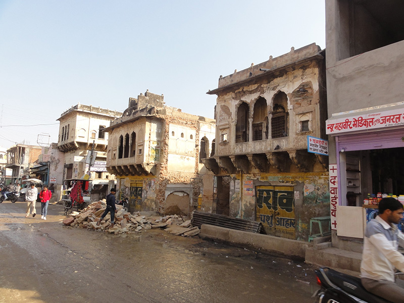 A handsome row of mid19th century shops in Lakshmangarh succumbs in 2015, ready for concrete replacements.